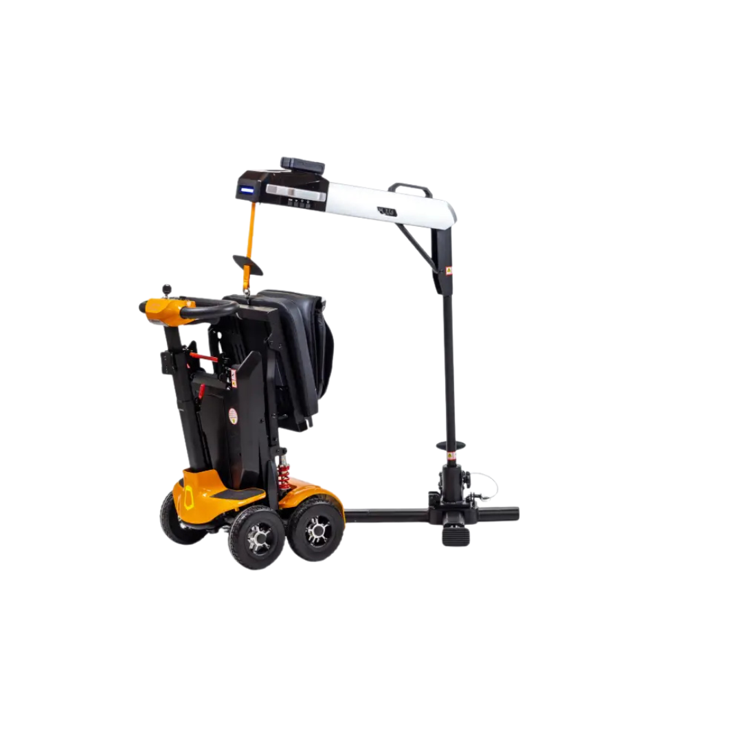 The Monarch Atlas 4 Portable Car Lift, a black mobile lift with a base, vertical and horizontal arms, holds a folded orange and black electric mobility scooter—ideal for easy scooter transport.